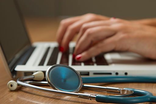 doctor speaking with patient on screen
